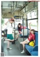 A group of young women sitting on a bus.