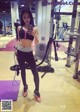 A woman taking a selfie in a gym.